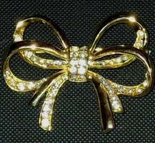 goldtone vintage double bow pin with rhinestones Nina Ricci 