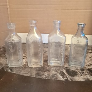 Antique Glass Medicine Bottles With Measurements On Them