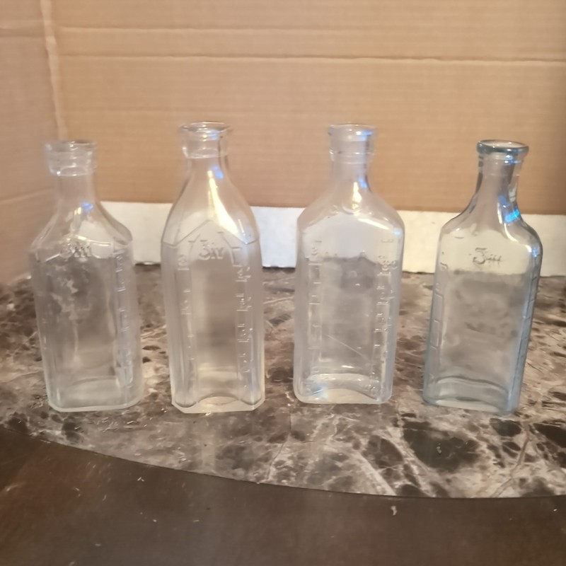 Antique Glass Medicine Bottles With Measurements On Them