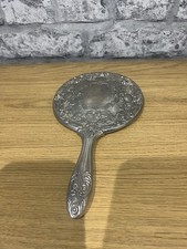Vintage Vanity Makeup Mirror Handheld Ornate Heavy Silver Plated or pewter .