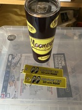 A Mooneyes black tumbler and keyrings 