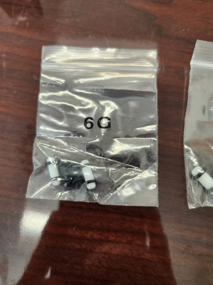 Kit de estiramiento de oreja de tabique de plástico blanco y negro de 6 g a 00 g 10 mm Foto 2 de 4