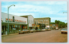 c1970 Downtown Genesee Street Iron River MI Postcard Ben Franklin Shaffer's News