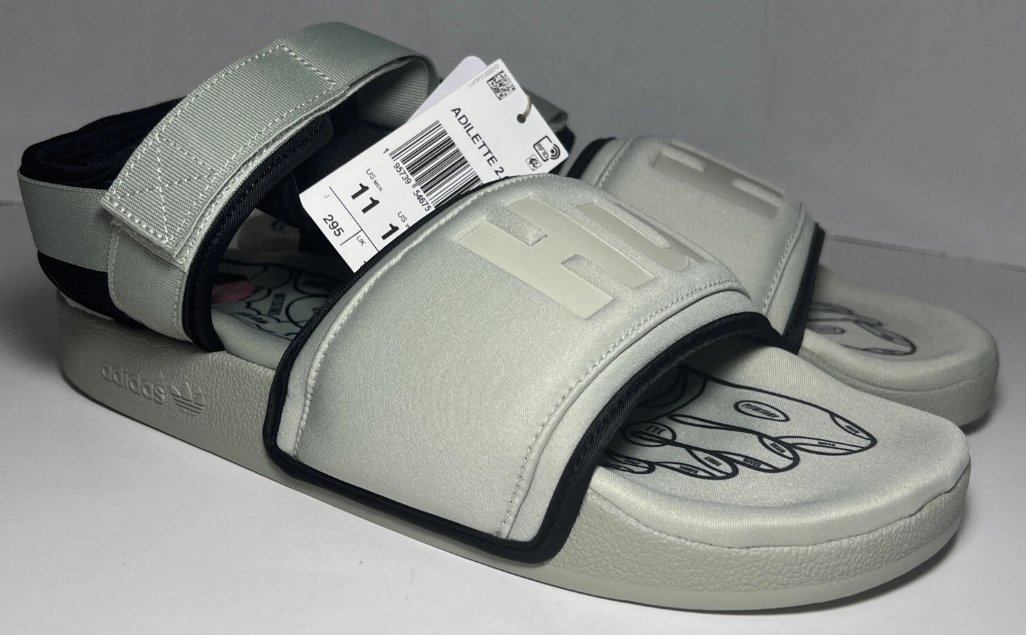 Sandali Adidas x Pharrell Adilette 2.0 Human Race HU da uomo taglia 11M 12W SPEDIZIONE ORA