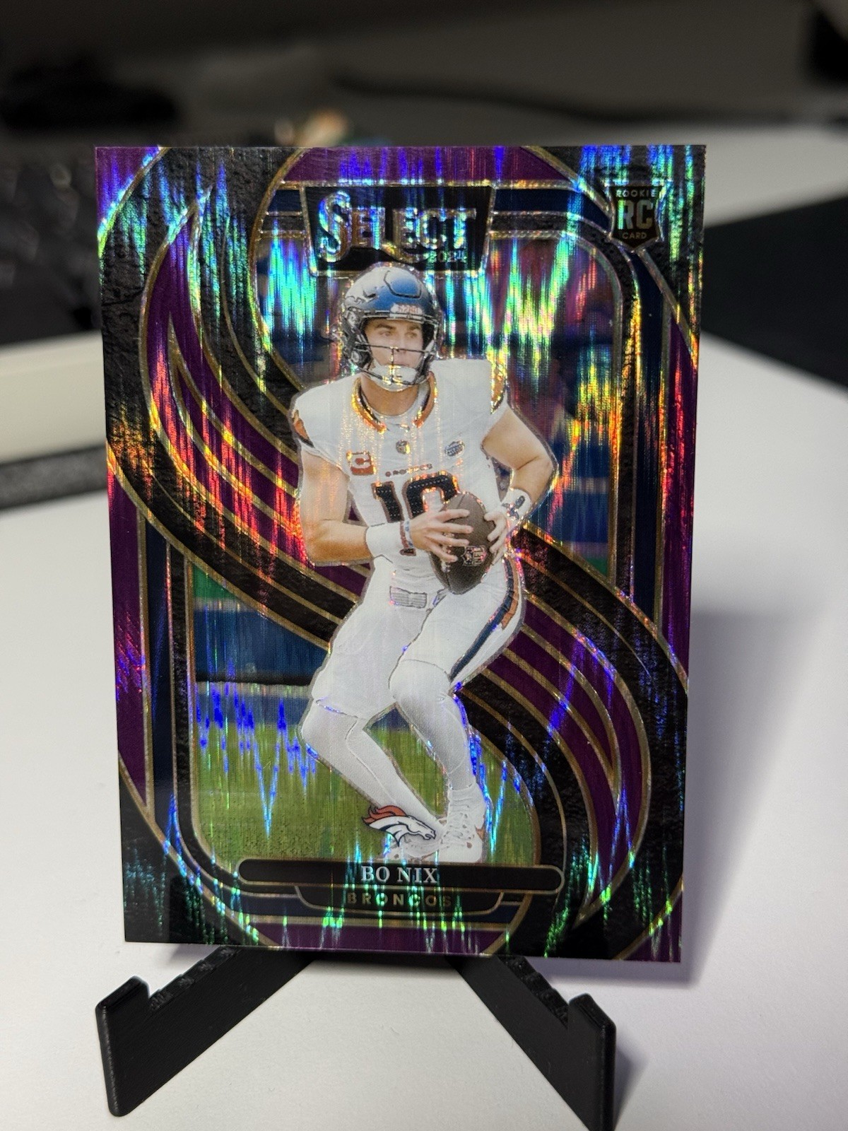 2024 Panini Select - Premier Level Bo Nix #117 Purple Shock Prizm /360 (RC)