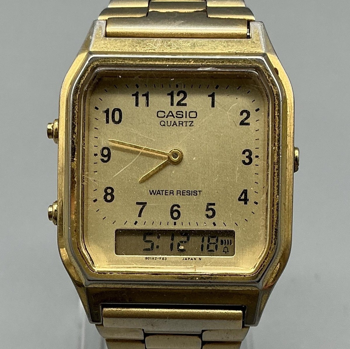 Vintage Casio 1301 AQ-230 Mens Watch 29mm Gold Tone Analog Digital