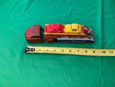 WYANDOTTE AUTO TRANSPORTCARS ARE PLASTIC AND TRUCK AND TRAILER ARE PRESSED STEEL
