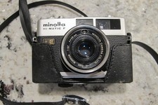 Minolta Hi-Matic F Rokkor w/ F/:2.7 35mm Film Camera  Half Case - Works great