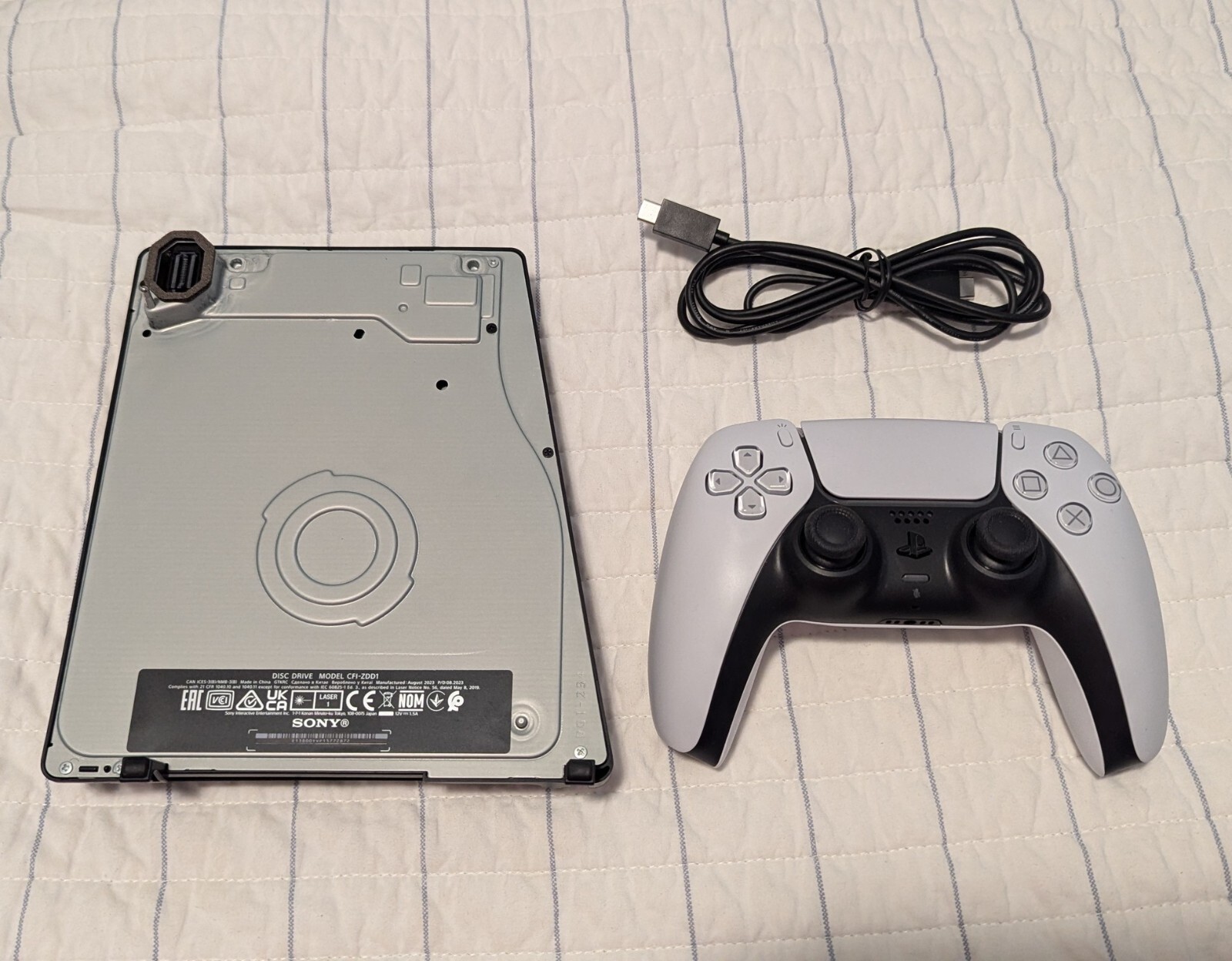 Sony Disc Drive for PS5 Slim and PS5 Pro consoles with Dualsense controller