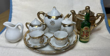 Miniature China Tea set: 2 teapots , 2 creamers, 2 cups/saucers, sugar, whiskey
