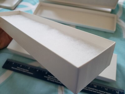 8 Storage, gift boxes with pads, new, white, for knives, watches, jewelry, etc.