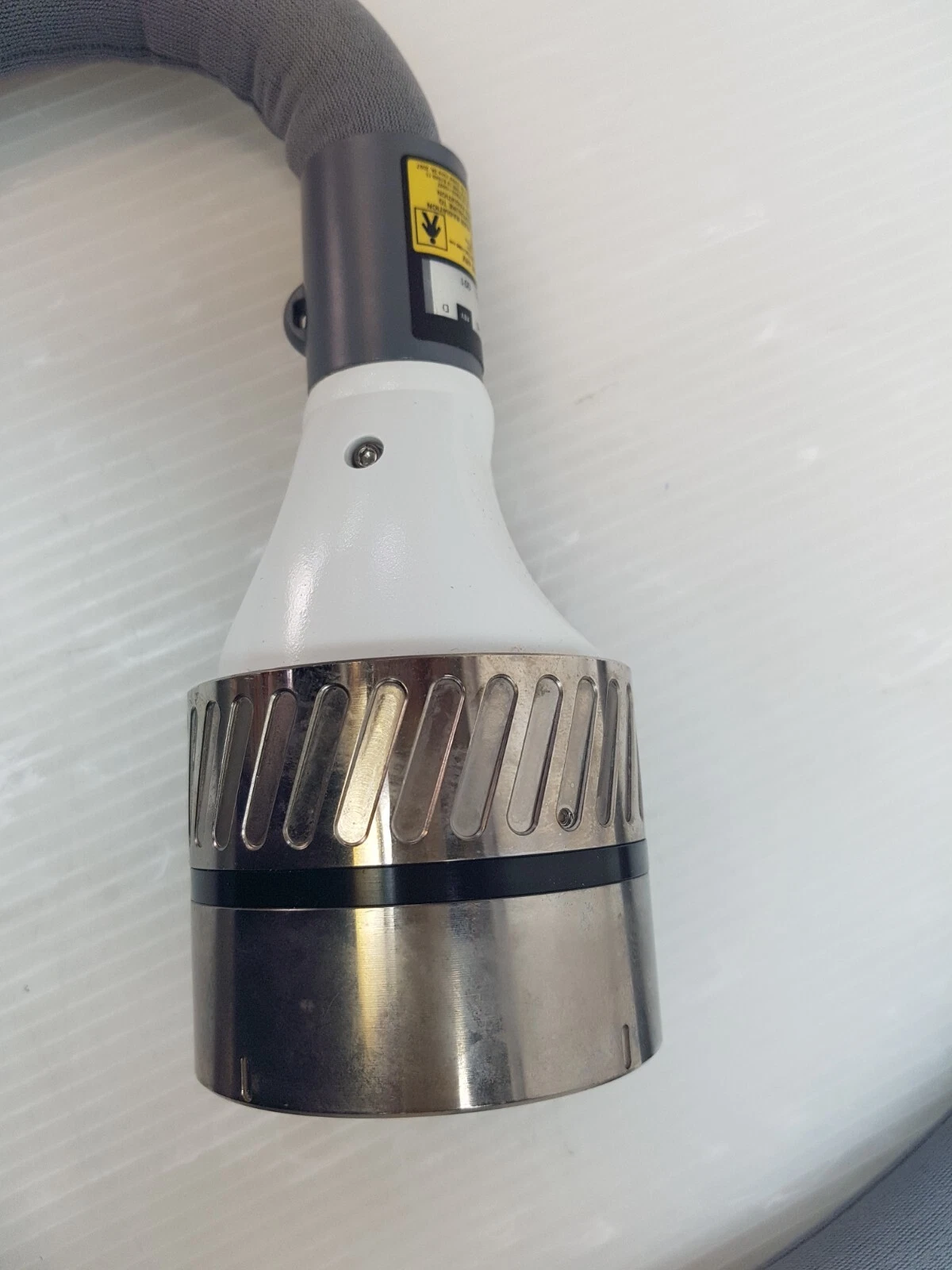 Metal connector coupling at the cable end of the Lumenis SA-10030610 handpiece