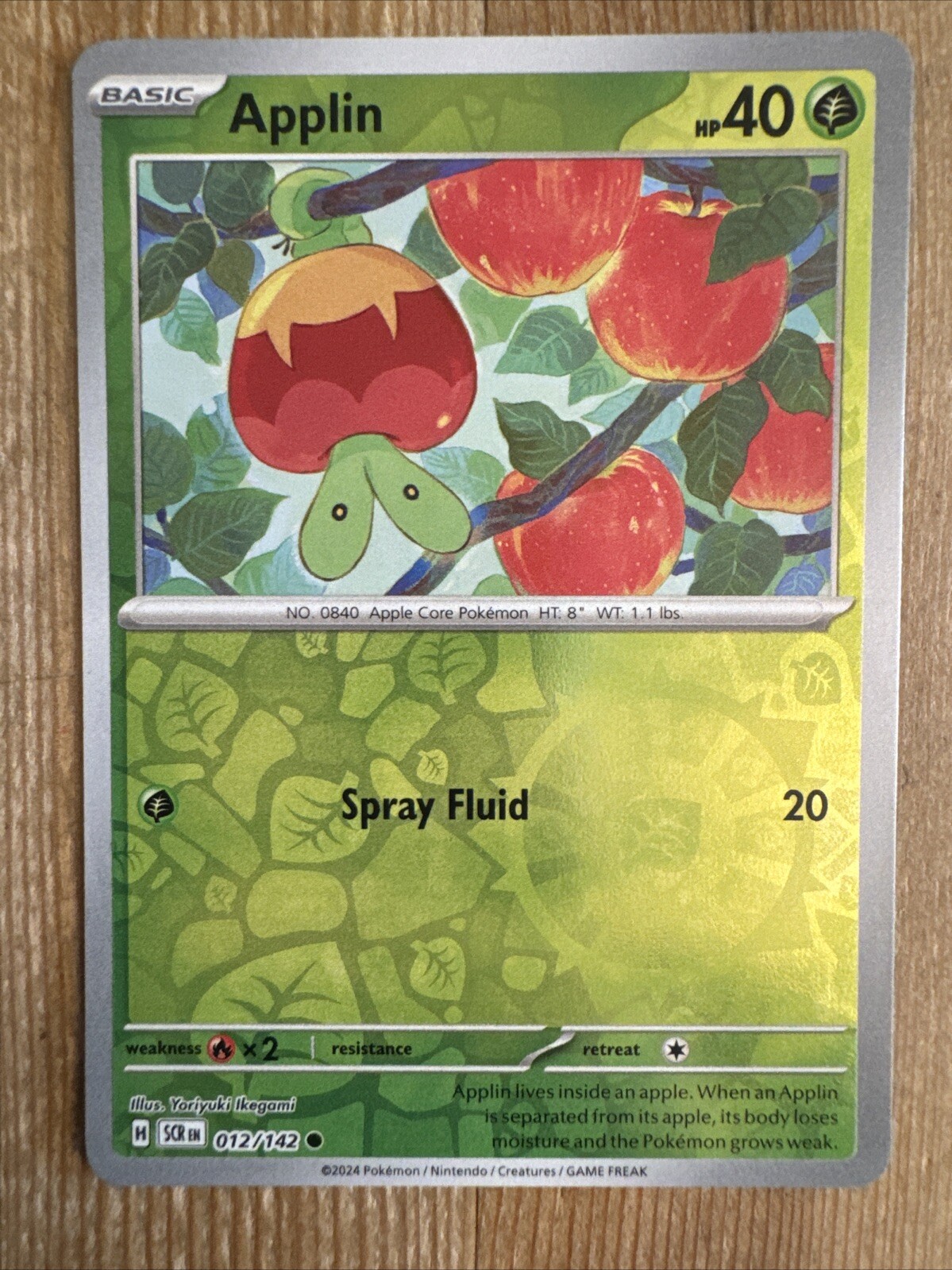 Applin 012/142 Stellar Crown Reverse Holo Pokemon Card NM