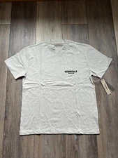 Fear of God Essentials Light Oatmeal Short Sleeve T-Shirt Sizes: XS-XXL