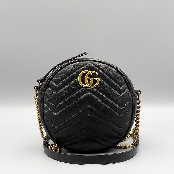 Gucci GG Marmont mini round crossbody bag in black leather with gold chain logo