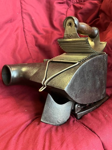 The 1888 H.S. Pease Combo Charcoal Sad Iron / Fluter with matching SECRET trivet