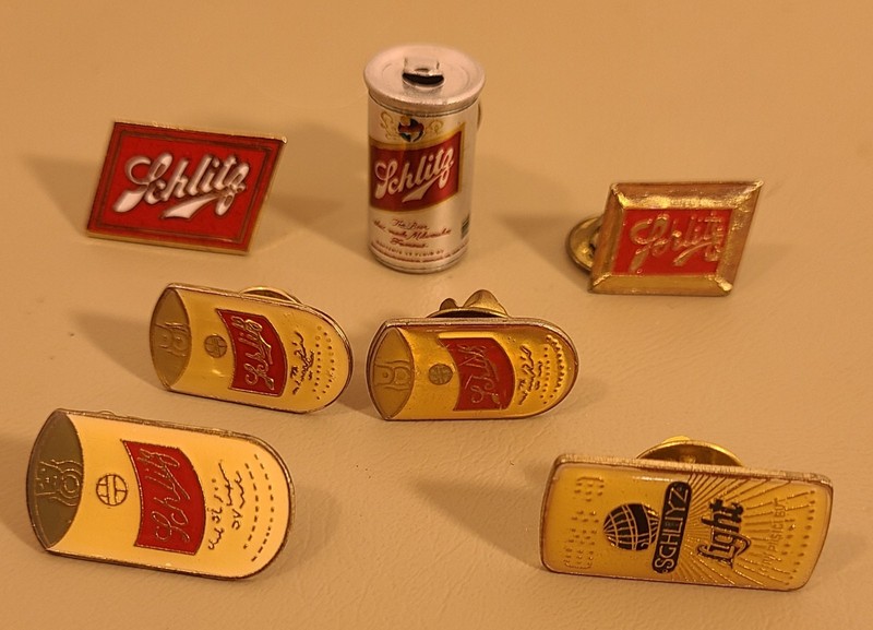 LOT OF 7 VINTAGE SCHLITZ BEER PINS  