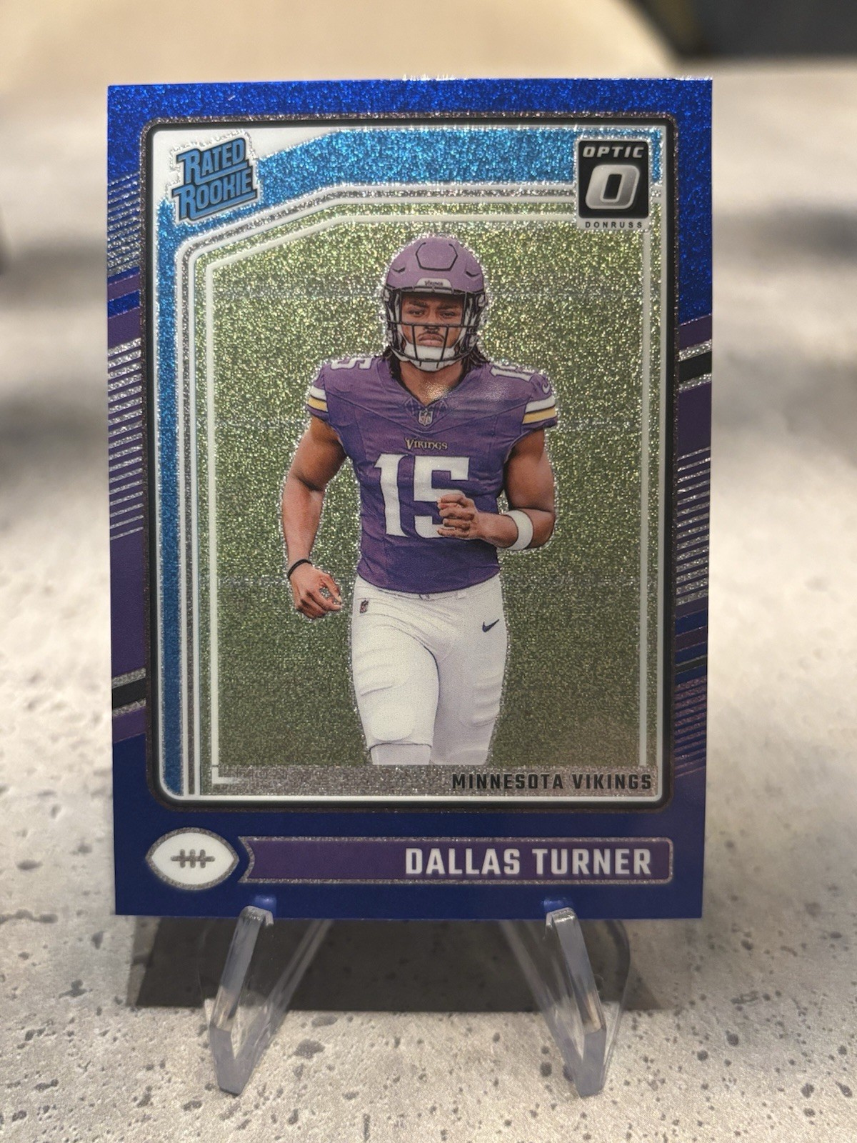 2024 Optic Dallas Turner Rated Rookie Blue Glitter SP #224 Vikings Mint