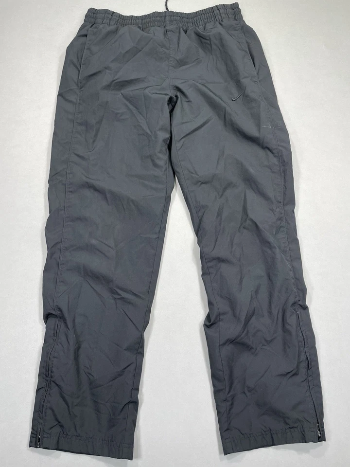 Pantalones cortavientos Nike de colección para hombre M pantalón de pista bolsillo negro atlético naranja etiqueta Foto 2 de 4