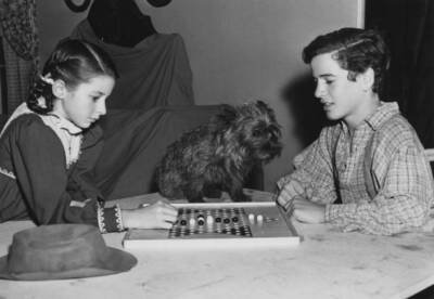 Virginia Weidler and Gene Reynolds playing Chinese checkers on - Old Photo