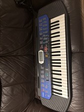 Casio CTK-411 Keyboard and power adapter.