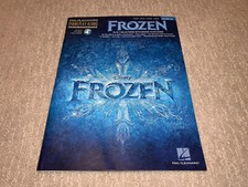 Cancionero Frozen para piano/voz/guitarra. Juego en línea incluido.