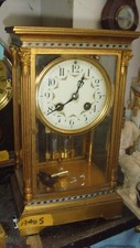 4  glass clock champleve aprox 11 inches tall all glaases intack working order