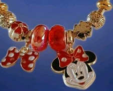 Disney's Minnie Mouse 8 charm Goldtone Stretch Style Bangled Bracelet. New.