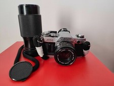 fotocamera Canon AT-1 reflex 35mm, perfettamente funzionante, due ottiche