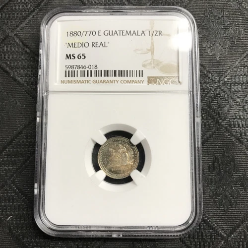 1880 / 770 E Guatemala Silver 1/2 Real NGC MS-65 toned