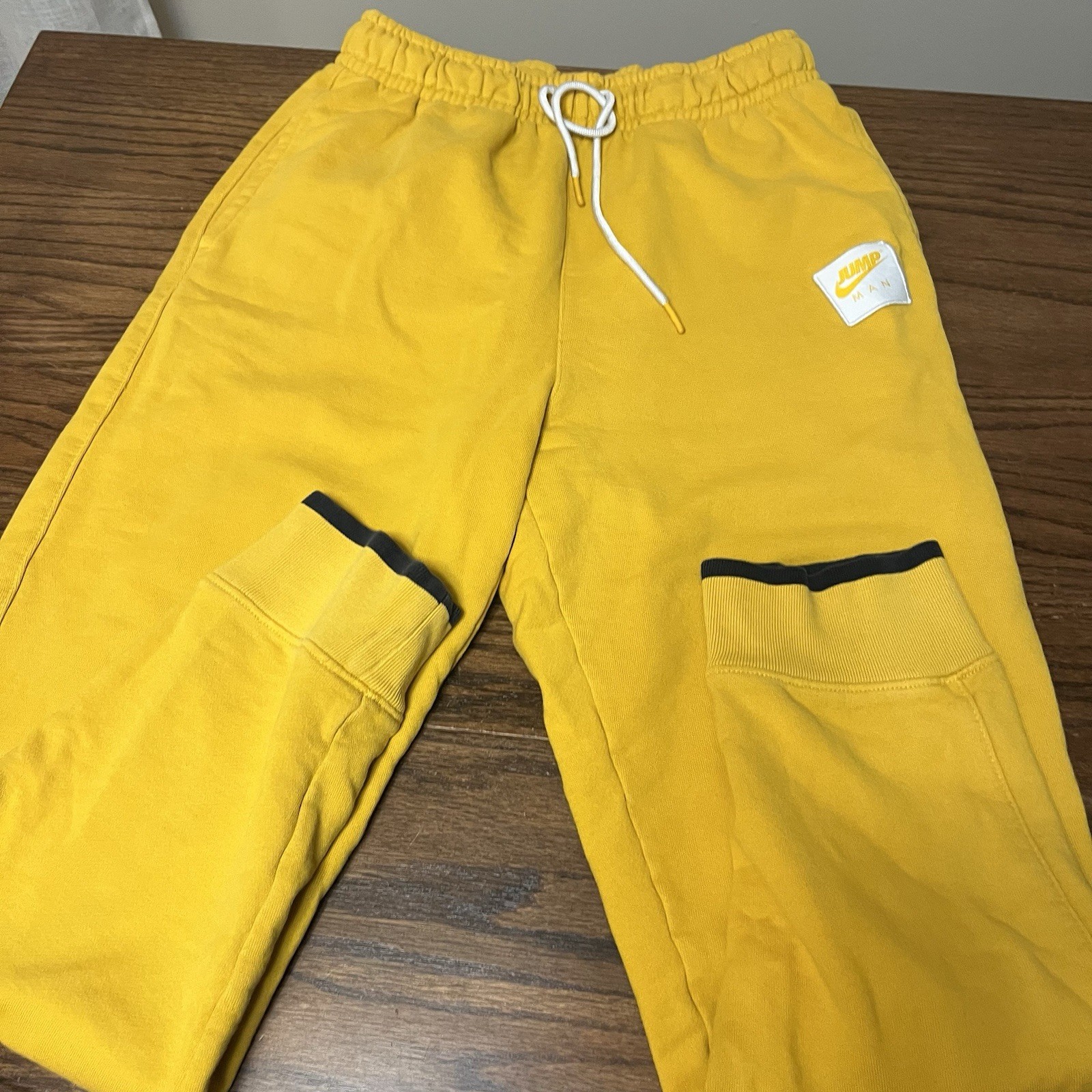 Nike Air Jordan Statement Essentials Fleece Pants Yellow Gold Mens M Jumpman