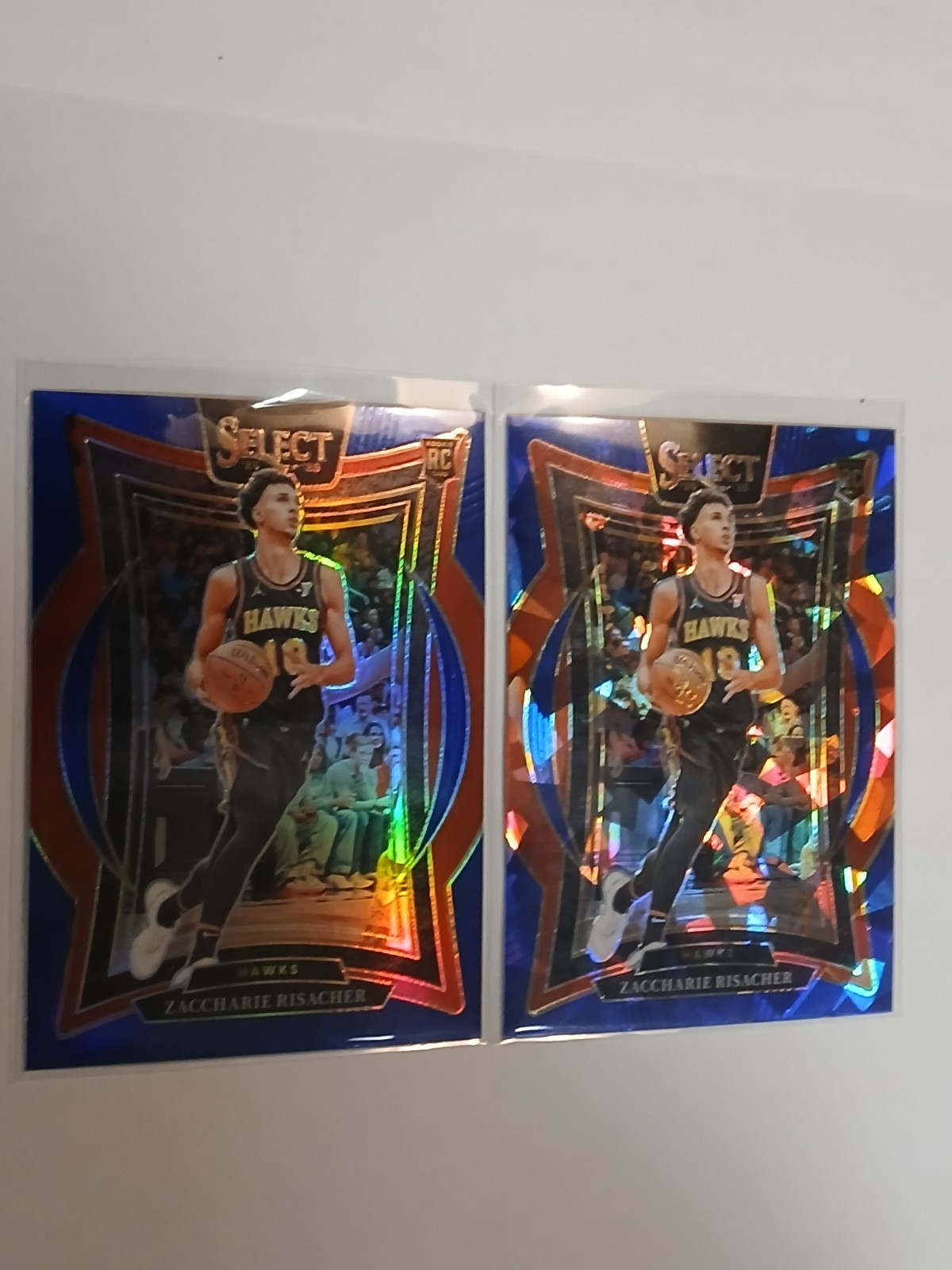 2024-25 Panini Select #86 Zaccharie Risacher Blue Cracked Ice/Prizm ROOKIE HAWKS