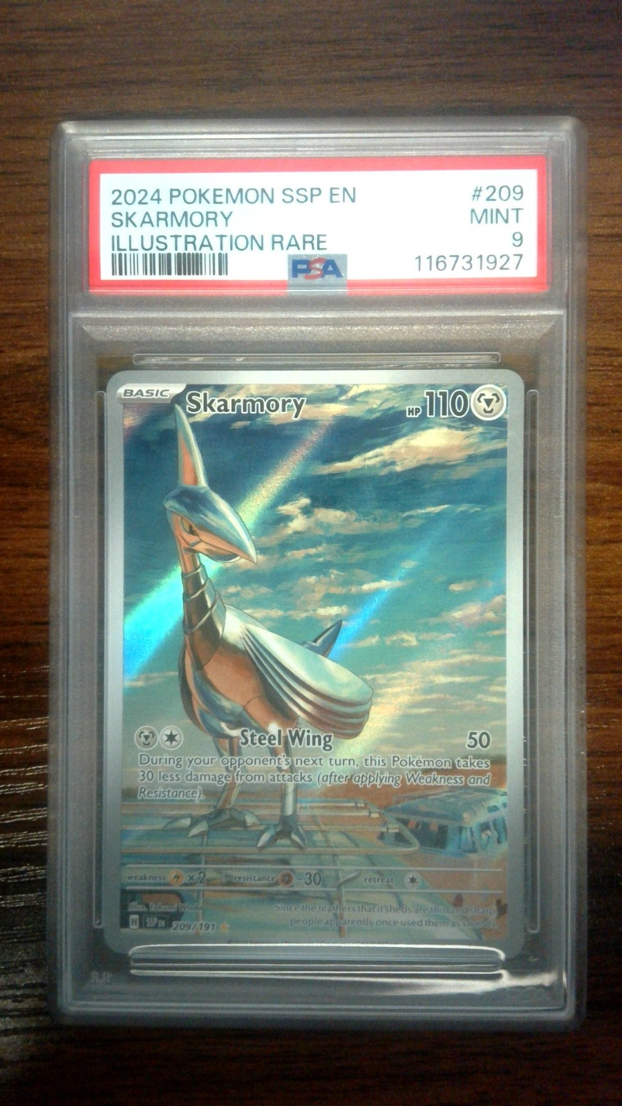 PSA 9 Skarmory #209/191 Pokémon Surging Sparks 2024