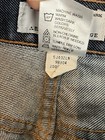 AX Armani Exchange J40 women’s size 8 short regular bootleg jeans with white label showing care and dye information.