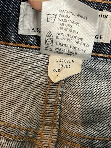 AX Armani Exchange J40 women’s size 8 short regular bootleg jeans with white label showing care and dye information.