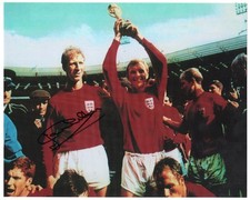 1966 WORLD CUP JACK CHARLTON HANDSIGNED COLOUR  PHOTOPRINT OF MOORE WITH TROPHY