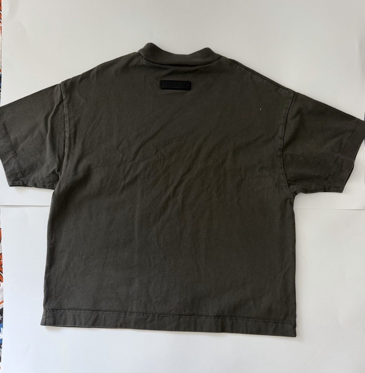 Essentials Fear of God Kids Short Sleeve T-Shirt in a dark olive/charcoal green View 2
