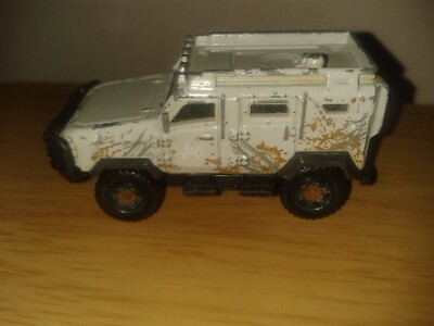 MATCHBOX - JURASSIC WORLD - 2017. TEXTRON TIGER. Grau cremefarben. (D26CB)