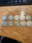 Lot 10 Morgan Silver Dollars (1878–1921)  Grades good to Higher, Collect or Melt