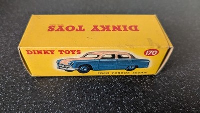 A boxed Dinky Toys No.170 low line red and cream Ford Fordor Sedan