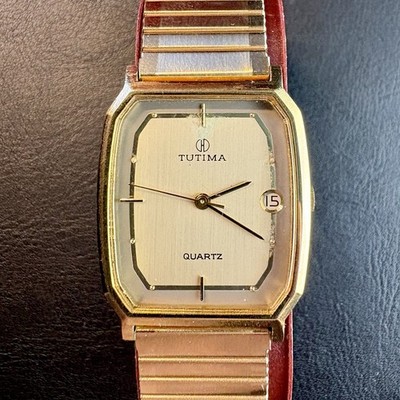 Tutima Quartz   elegante Vintage Herrenarmbanduhr im goldfarbenen Design
