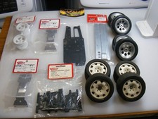 Vintage Kyosho Optima 4wd belt drive, wheels and tires parts lot new and used
