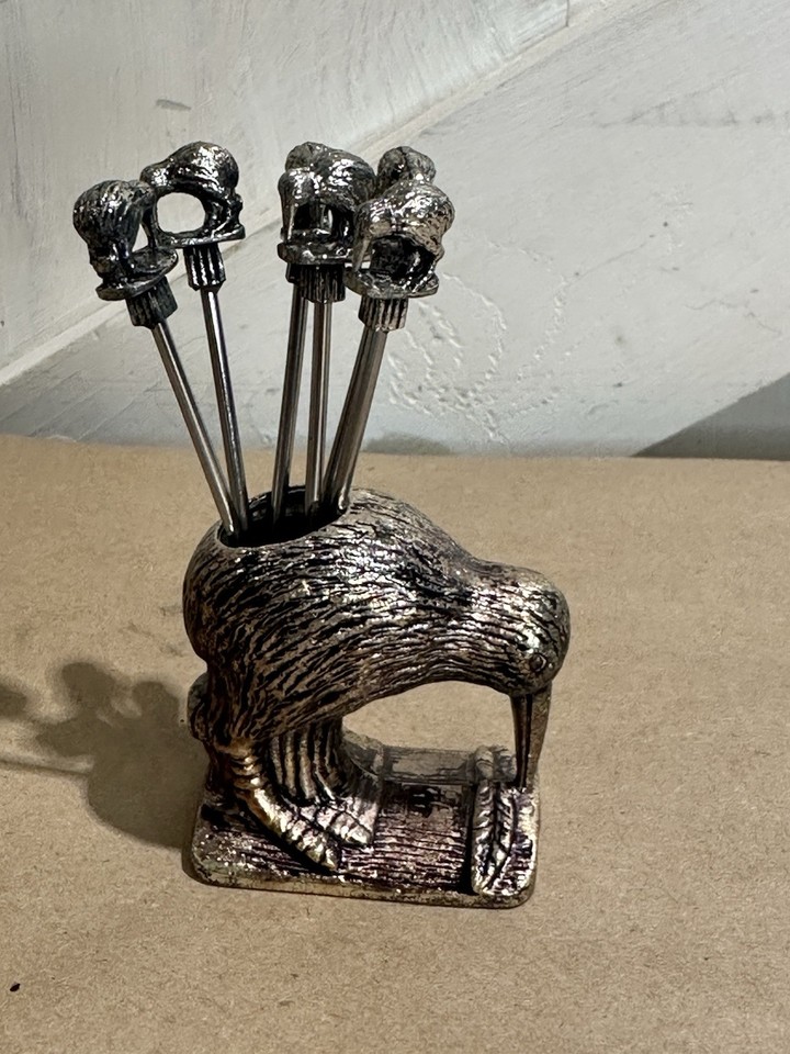 Pewter kiwi bird cocktail pick holders are the kind of delightfully specific vintage barware nobody knows they need until they see it.