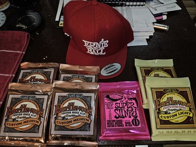 ERNIE BALL GUITAR STRING LOT + HAT EARTH
