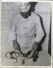 1941 Press Photo Dog Service Deluxe, Finishing touches on a raw meat patty