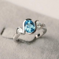 Lab Created Blue Topaz 3Ct Oval Cut Three Stone Engagement Ring 14K Gold Plated
