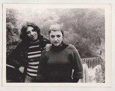 Two Women, One Waterfall, and the Weight of a Shared Secret in Their Eyes Photo