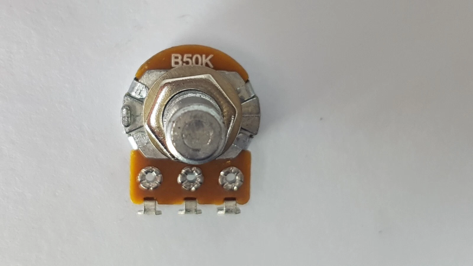 B50K marking on an Alpha potentiometer, with bushing, nut and shaft end