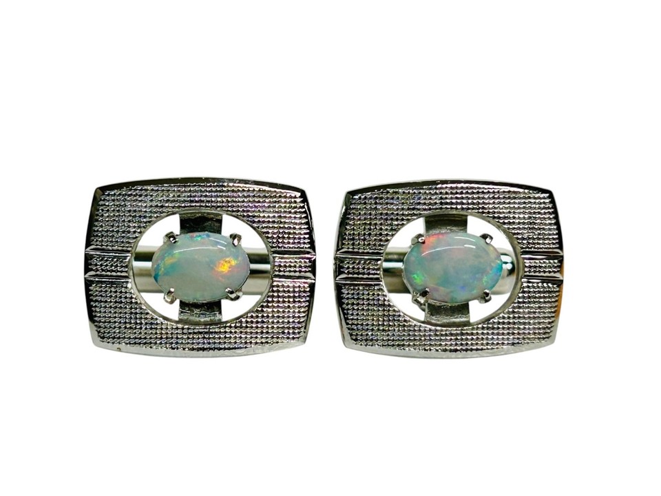 Vintage silver-tone cufflinks set with genuine opals — each stone unique, with that characteristic play-of-color that no modern mass-market accessory can replicate.