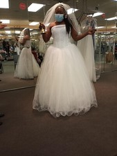 Tulle wedding dress with beaded satin bodice with built in corset.